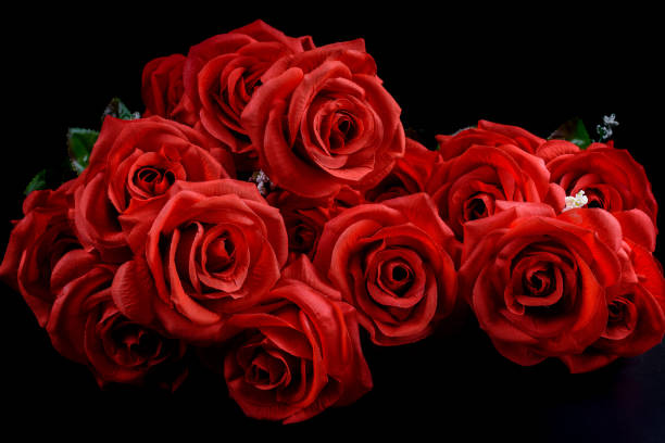 istock Bouquet of red roses on black background 1095840724