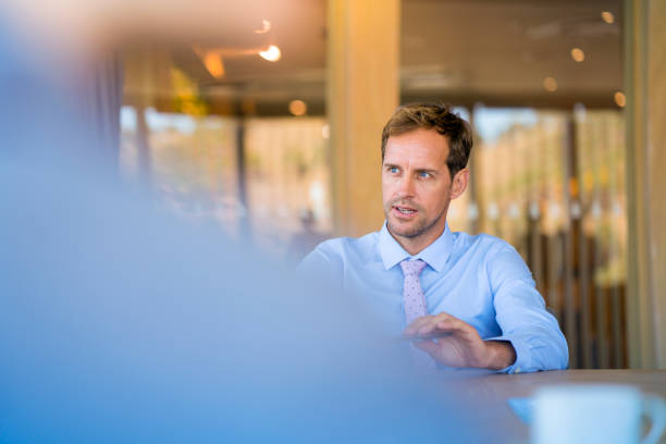 istock Confident executive talking in meeting at office 1095842898
