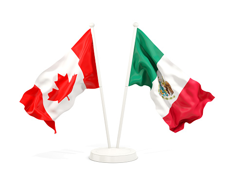 Two waving flags of Canada and mexico isolated on white. 3D illustration