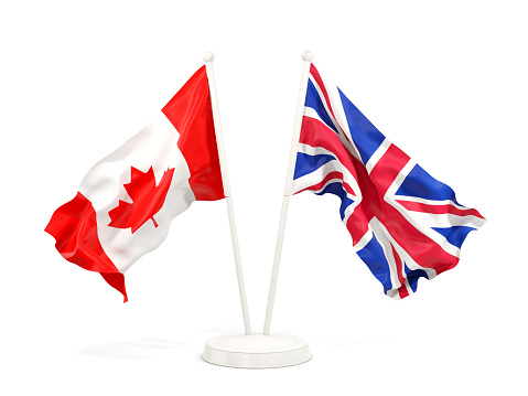 Two waving flags of Canada and UK isolated on white. 3D illustration