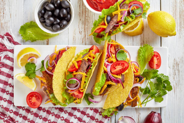 istock tacos on a white plate, top view 1095858904