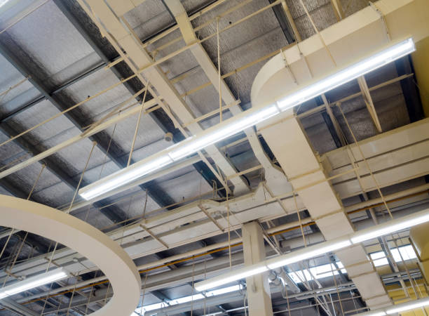 istock Ceiling mounted Lamps pipes and air ducts and communication system 1095859250