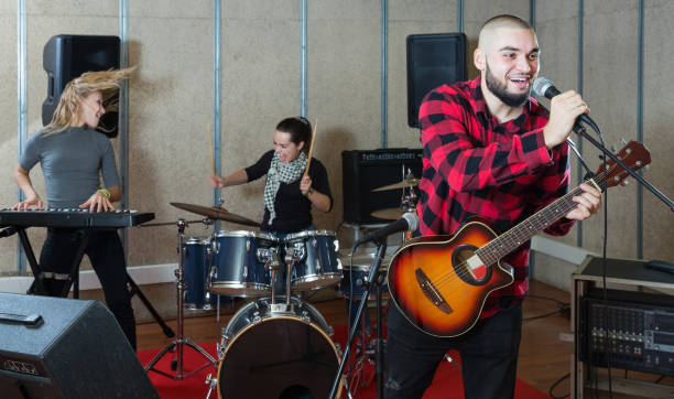 istock Emotional guy with guitar rehearsing 1095862854