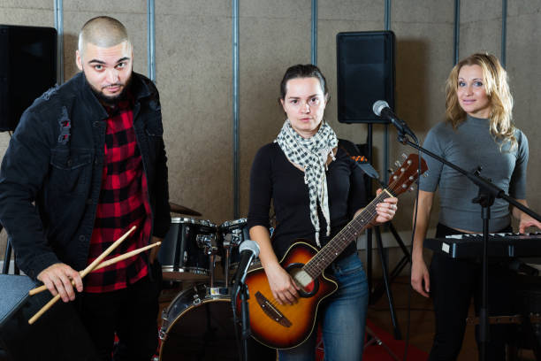 istock Young guitarist, drummer and keyboardist 1095862940