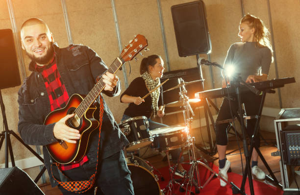 istock Emotional guy with guitar rehearsing 1095862950