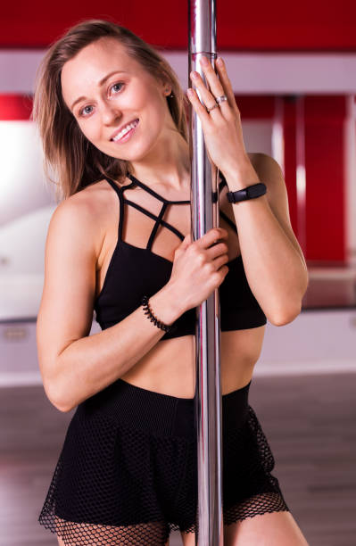 Woman enjoying pole dancing workout