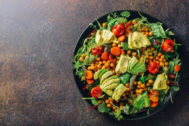 istock Avocado, roasted tomato, greens and chickpeas salad 1095867830