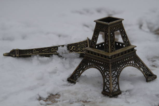 photo of beautiful Eiffel Tower shaped souvenir and ribbon on the wonderful black studio background