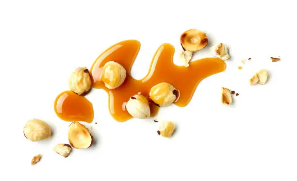 Photo of hazelnuts and caramel sauce