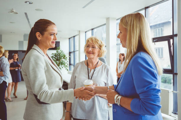 istock Businesswomen shaking hands during seminar 1095880172