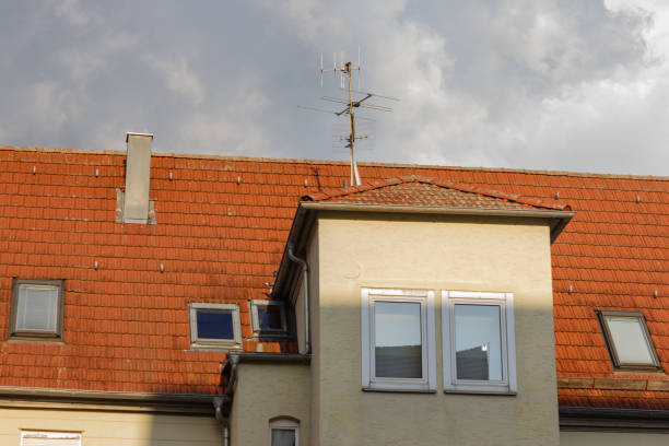 istock rooftop with antenna on historical buildings 1095883234