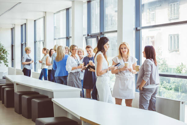 Business women shaking hands on business event after deal on interview