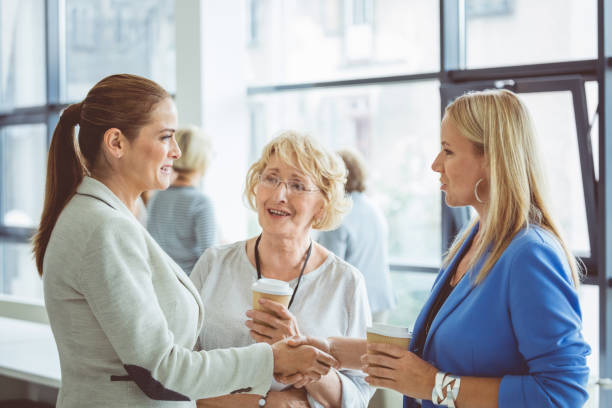 istock Women meeting during seminar break 1095886778