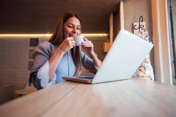 istock Woman enjoying coffee at cafe 1095887406