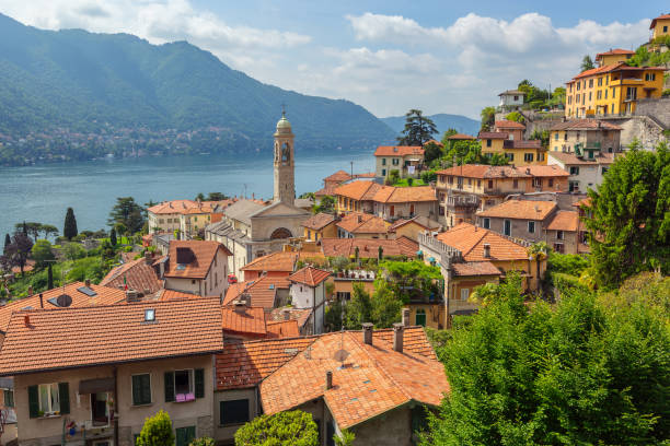 Church in town at coast of Como lake Old church in town at the coast of Como lake, Italy como italy stock pictures, royalty-free photos & images