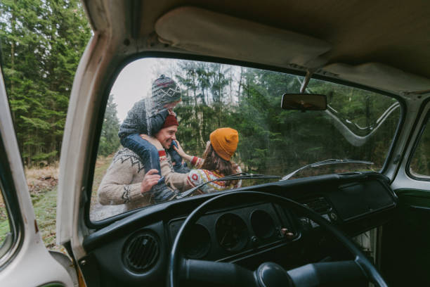 Family with son  near the van in forest Family with little boy  near the van in forest rv travel stock pictures, royalty-free photos & images