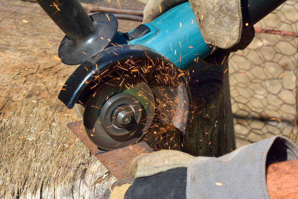 istock Electric grinder. A man working with electric grinder tool on steel structure, sparks flying 1095895830