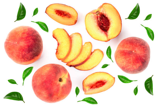 istock ripe peaches with leaves isolated on white background. Top view. Flat lay pattern 1095903606