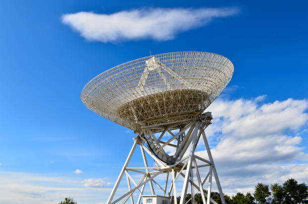 istock Array of satellite dishes or radio antennas against sky. Space o 1095907042