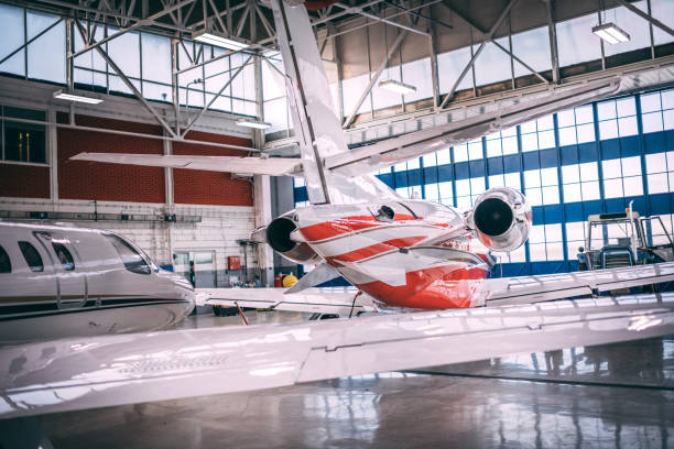 istock Small airplanes parked in a hangar 1095912960