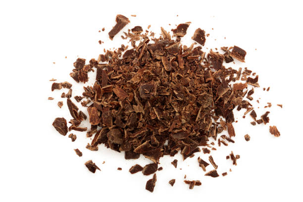 istock grated chocolate isolated on white background. Top view 1095915842