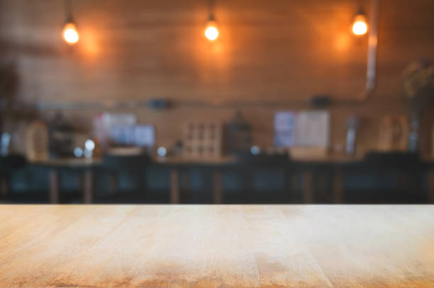 istock empty wooden plank with blurred cafe bar background. 1095921560