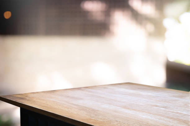istock empty wood table with blur montage outdoor garden background 1095927712