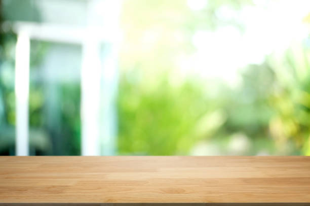 istock empty wood table with blurred montage nature green place background 1095927898