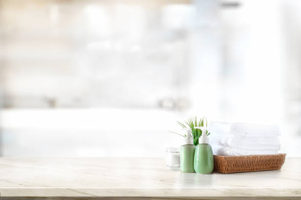 istock Ceramic shampoo, soap bottle and towels on counter over bathroom background. table top and copy space 1095928652