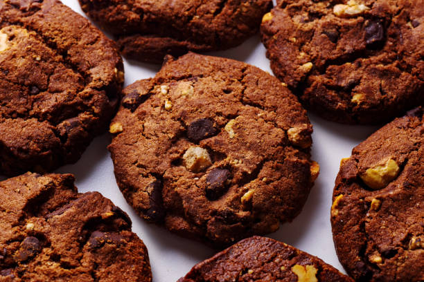 istock Overhead closeup image of chocolate cookies on white background 1095937668