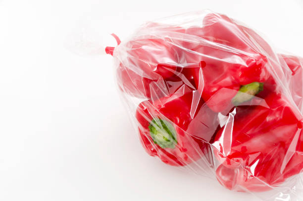 istock Red bell pepper in plastic bag on white background 1095939984