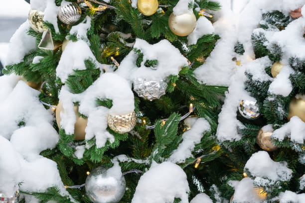 istock Christmas tree with decorations in the snow. Close-up 1095943820