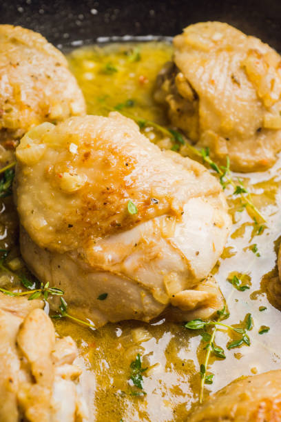istock Roasted chicken in a pan with cream sauce and spices 1095947344