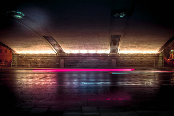 istock Car light trails in the tunnel. Abstract art image. 1095949158