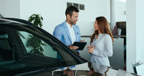 istock Car salesman with a customer 1095954052