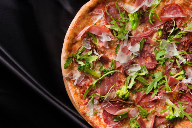 istock italian pizza with bacon and vegatebles 1095957140