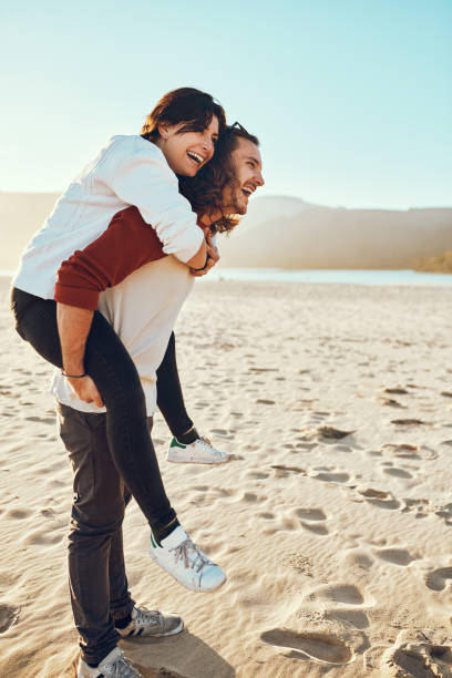 istock Piggybacks on the beach 1095957560