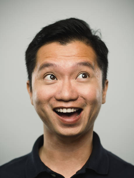 istock Real chinese man with very excited expression looking around 1095958686