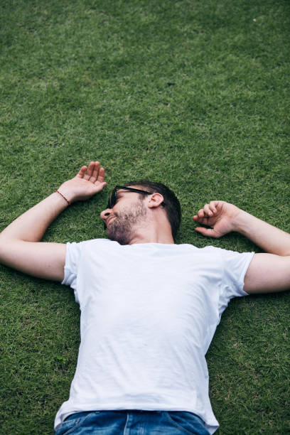istock Man enjoying in summertime on a grass field. 1095967358