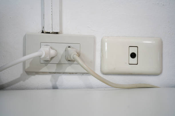 istock power electric plug and cable tv on the wall 1095967432
