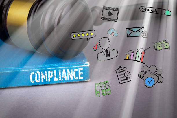 istock Compliance concept. blue book on a gray office table 1095970734