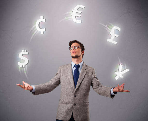 istock young man standing and juggling with currency icons 1095970754