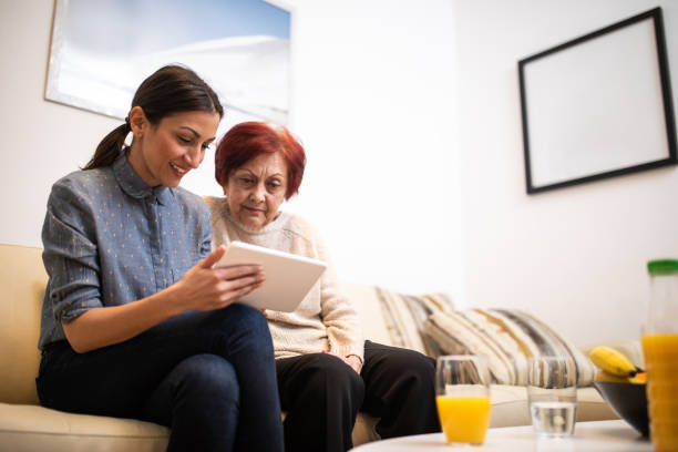 istock Modern grandma with granddaughter 1095973982