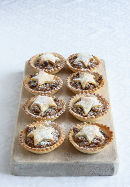 istock Baked Mince pies for Christmas on whitewashed board with light grey marble table top 1095975550