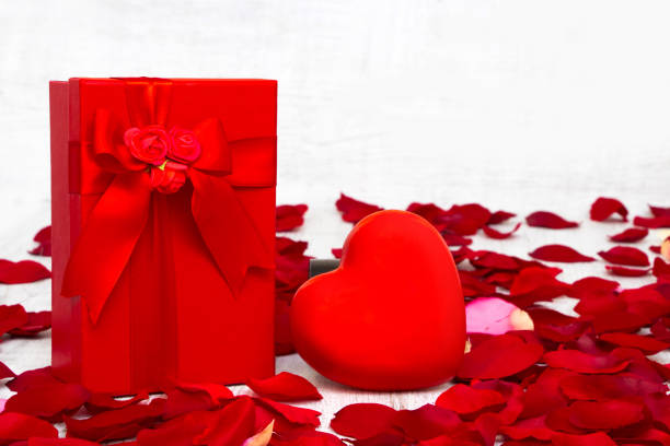 istock Surprise gift boxes on rose petals, valentines day 1095975914