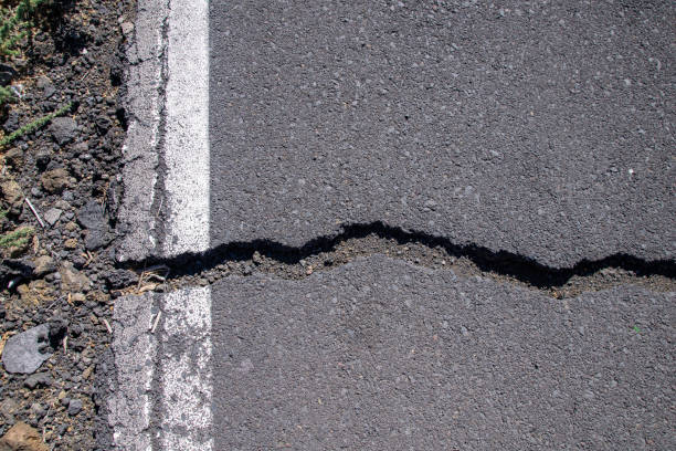 istock Cracks in road surface in La Palma, Canaries, Spain 1095977192
