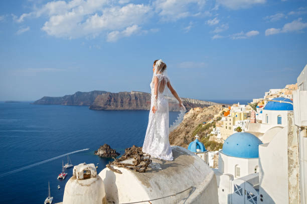 istock Bride in white dress on the  roof 1095977248