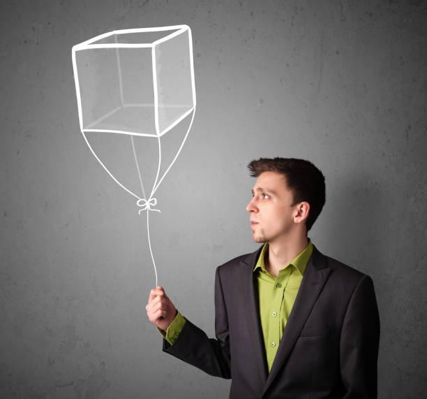 istock Businessman holding a cube balloon 1095978818