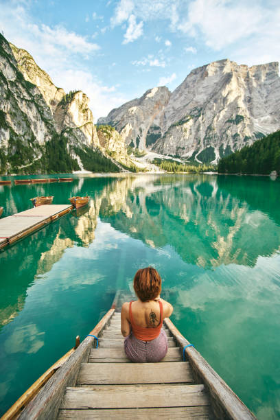 istock Young lady enjoy the nature at a beautiful lake . 1095979608