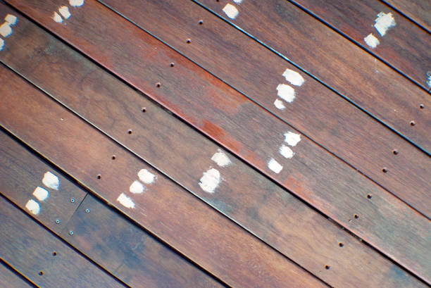DIY merbau timber deck with holes puttied up ready to be sanded back and then stained